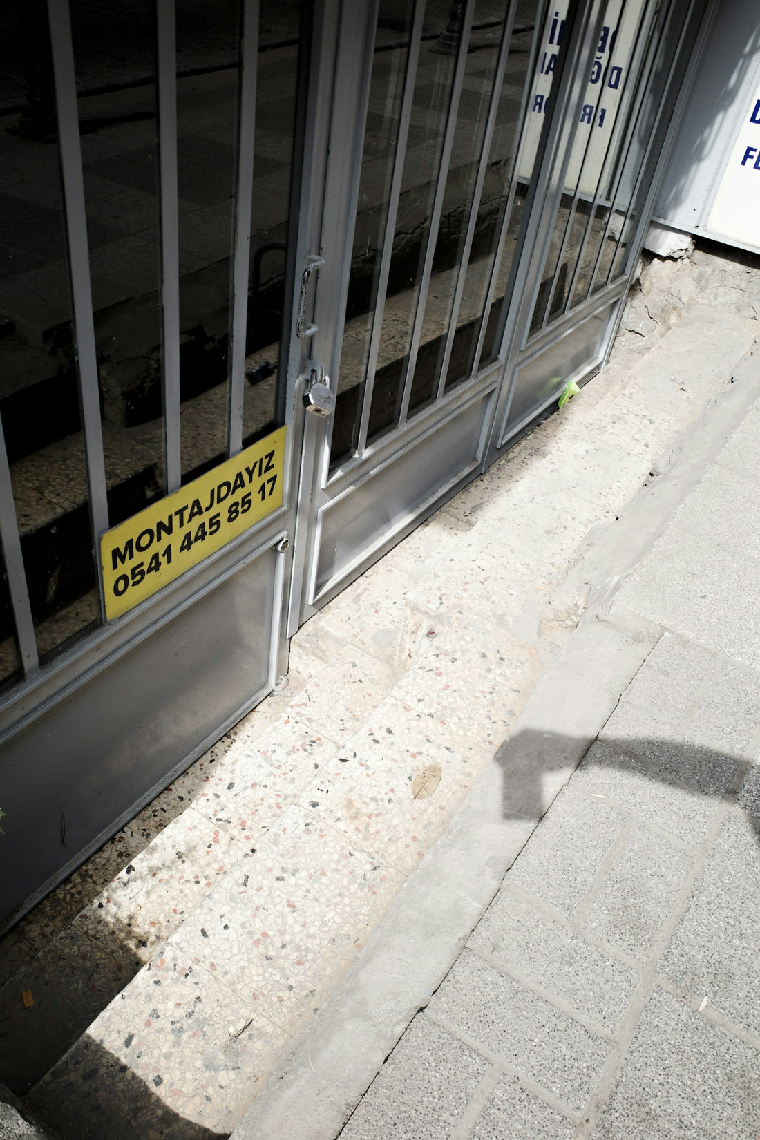 A yellow sign that is on the side of a door