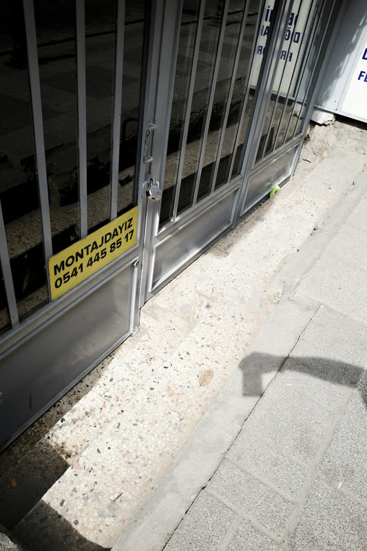 A yellow sign that is on the side of a door