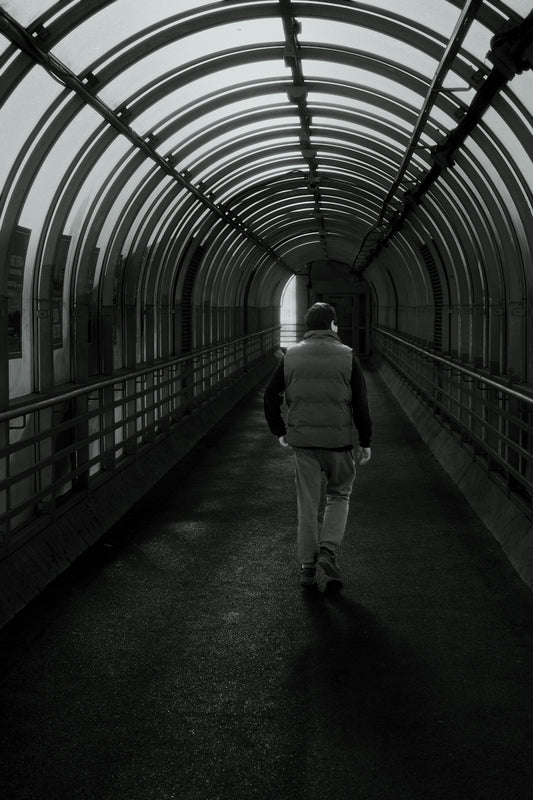 Man walking through a modern covered walkway